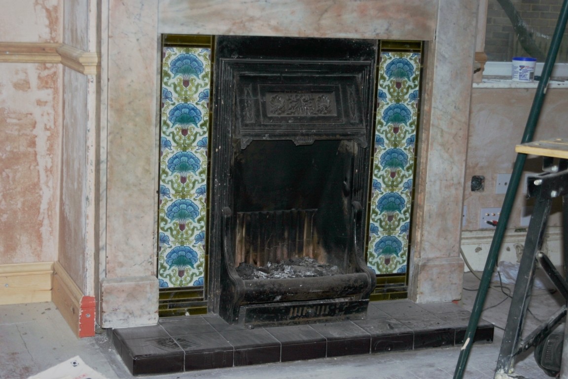 Living Room With Plaster And Fireplace